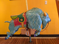 buffalo color:blue color:yellow floor merry-go-round_seat subject:object type:photograph wall wood // 2667x2000 // 820KB