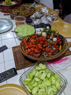 beef beer_can color:green color:red color:yellow cucumber cutting_board food guacamole meat onion plate remote_control salsa sausage subject:object table tile type:photograph // 2000x2667 // 743KB